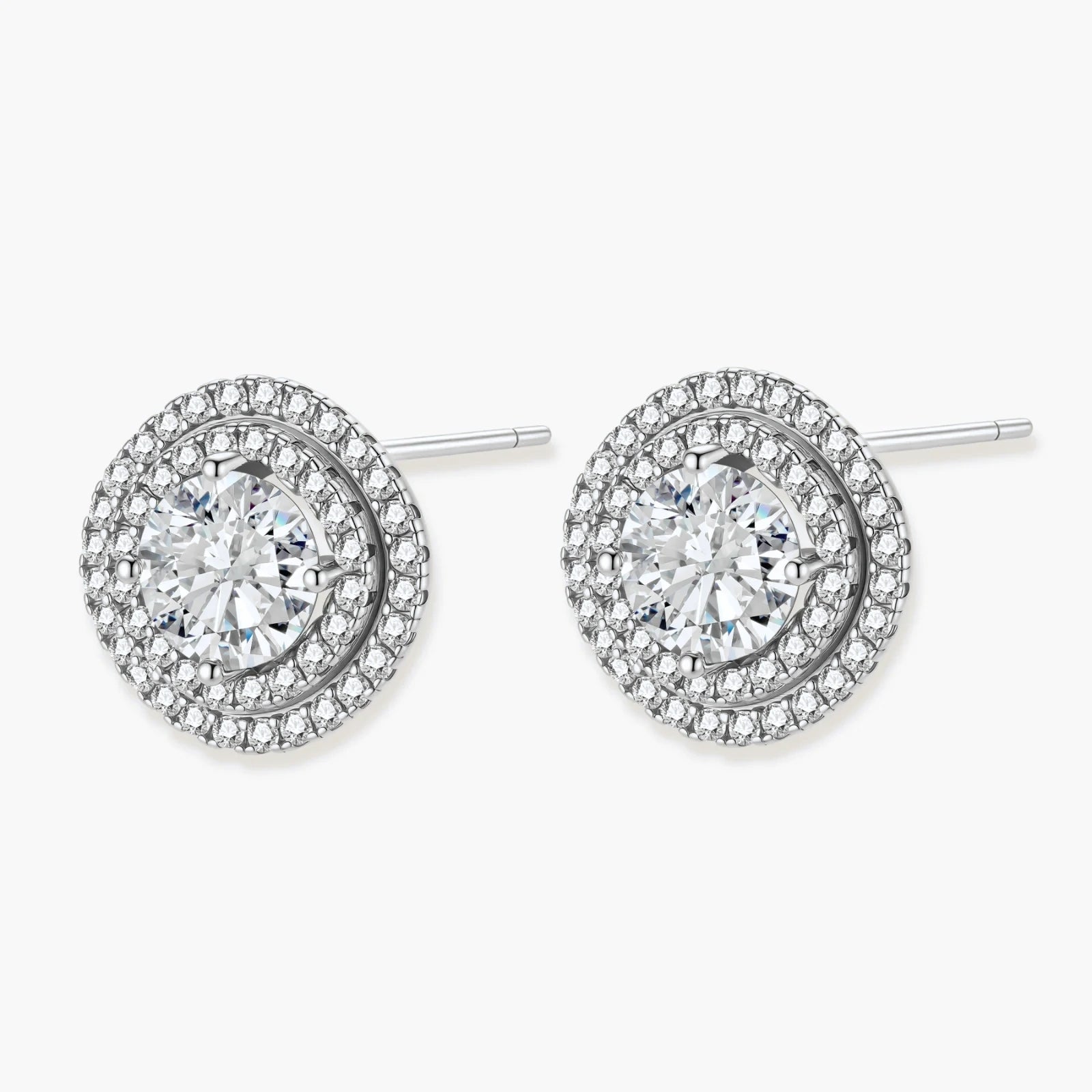 Double halo sterling silver stud earrings with brilliant round moissanite center stones and pavé crystal accents