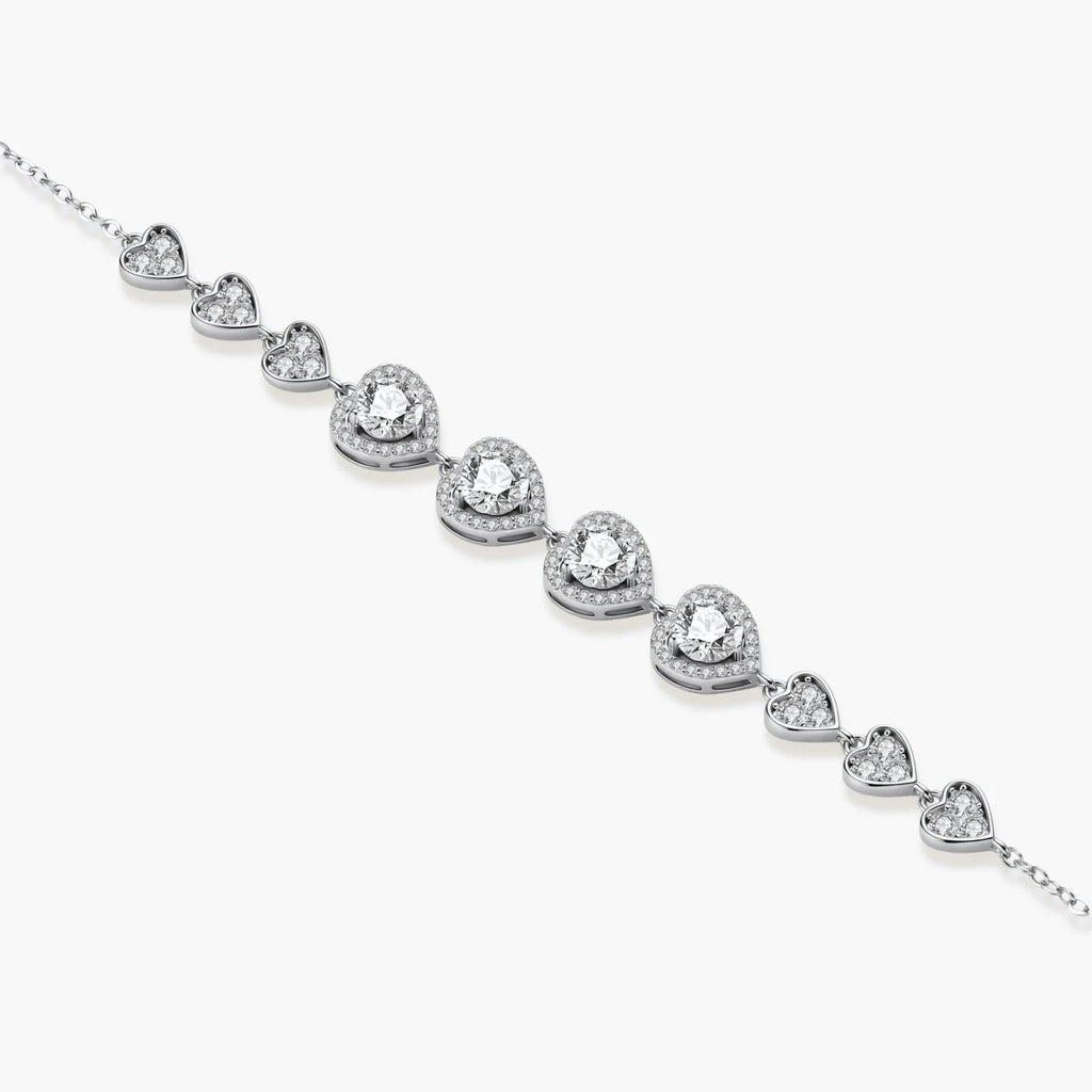 Complete jewelry set with heart-shaped sterling silver pieces featuring brilliant moissanite stones on white background.