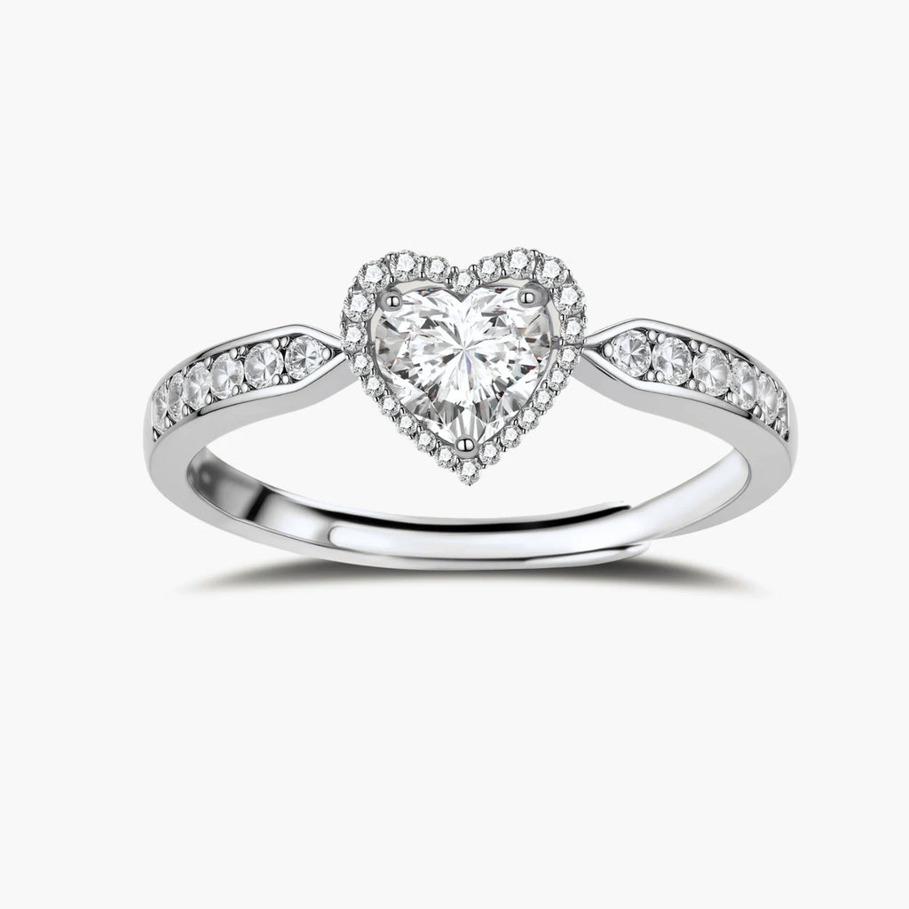 Complete jewelry set with heart-shaped sterling silver pieces featuring brilliant moissanite stones on white background.
