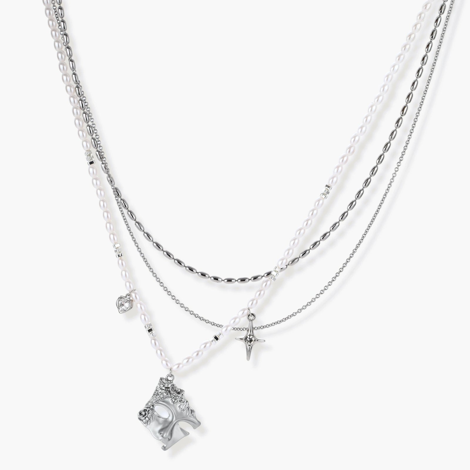 Multi-strand layered necklace set with silver chains, white pearls, star charm, heart pendant, and ornate decorative piece