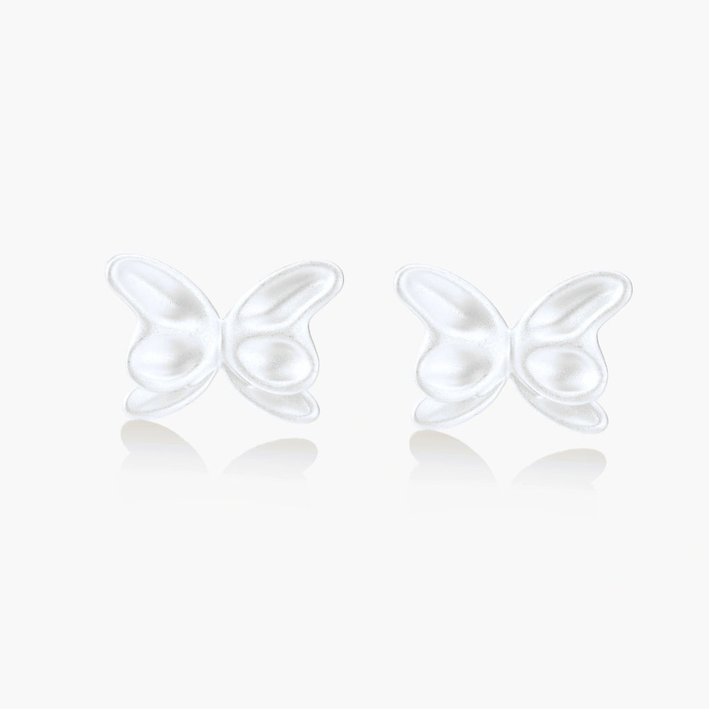 Pair of translucent butterfly-shaped stud earrings with frosted finish and dimensional wing details on white background