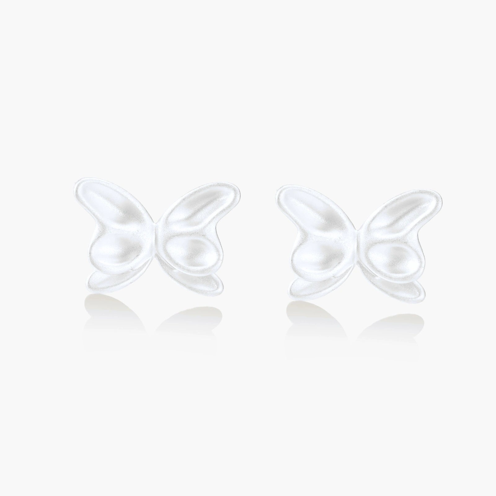 Pair of translucent butterfly-shaped stud earrings with frosted finish and dimensional wing details on white background