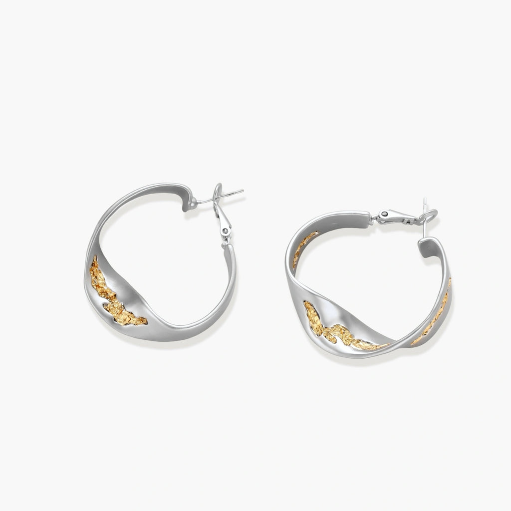 Silver hoop earrings with organic gold flowing accents, featuring eco-zinc alloy construction and secure posts.