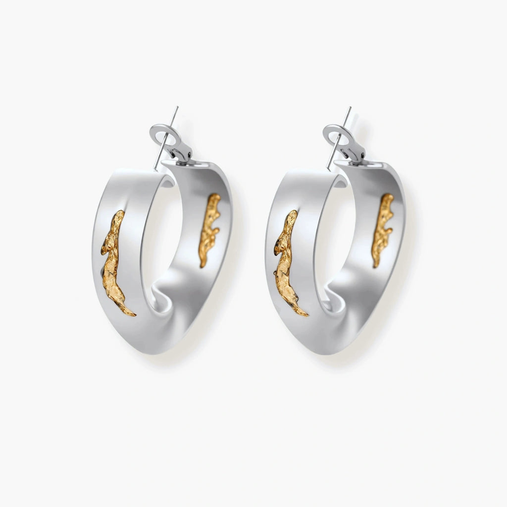 Silver hoop earrings with organic gold flowing accents, featuring eco-zinc alloy construction and secure posts.