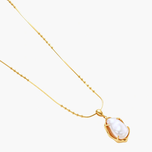 18K gold-plated sterling silver necklace with alternating bead chain and baroque pearl pendant on neutral background.