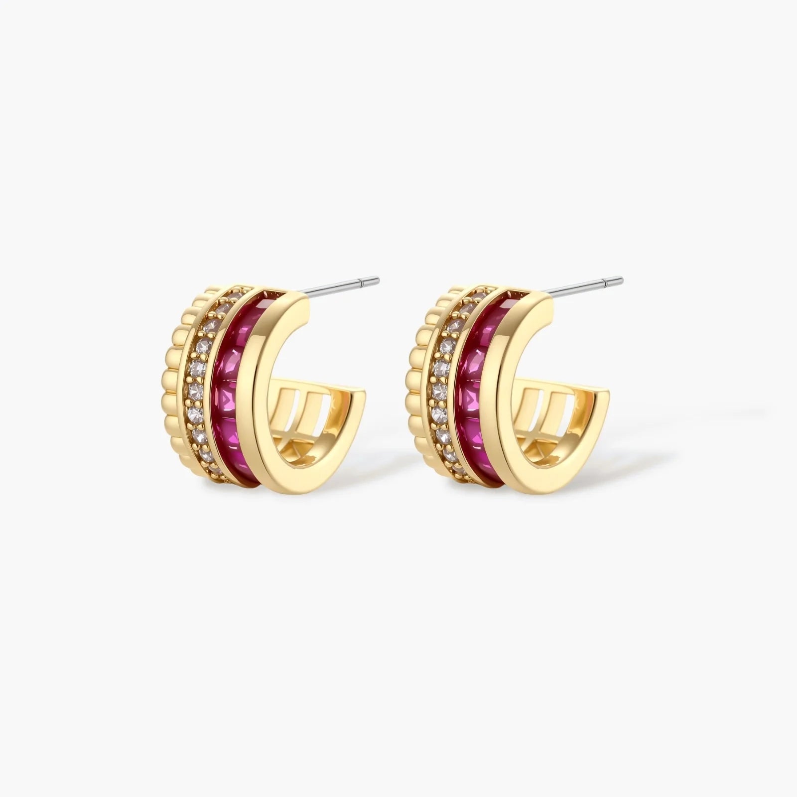 Three-piece jewelry set featuring 14K gold plated pieces with deep red cubic zirconia stones and clear crystals on cream background.