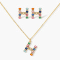 Gold-plated letter H jewelry set with multicolor zirconia stones in emerald cuts, showing necklace pendant and matching earrings