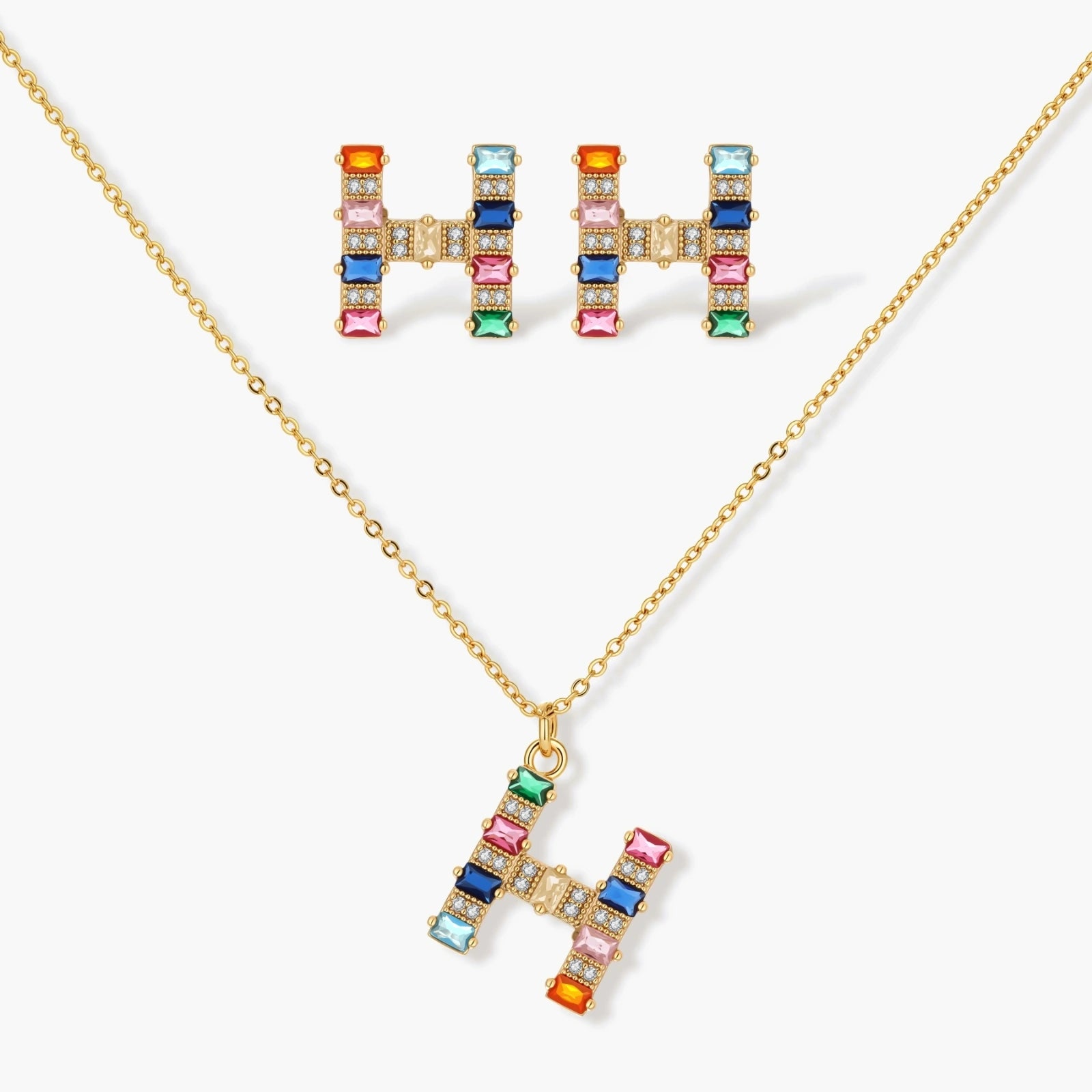 Gold-plated letter H jewelry set with multicolor zirconia stones in emerald cuts, showing necklace pendant and matching earrings