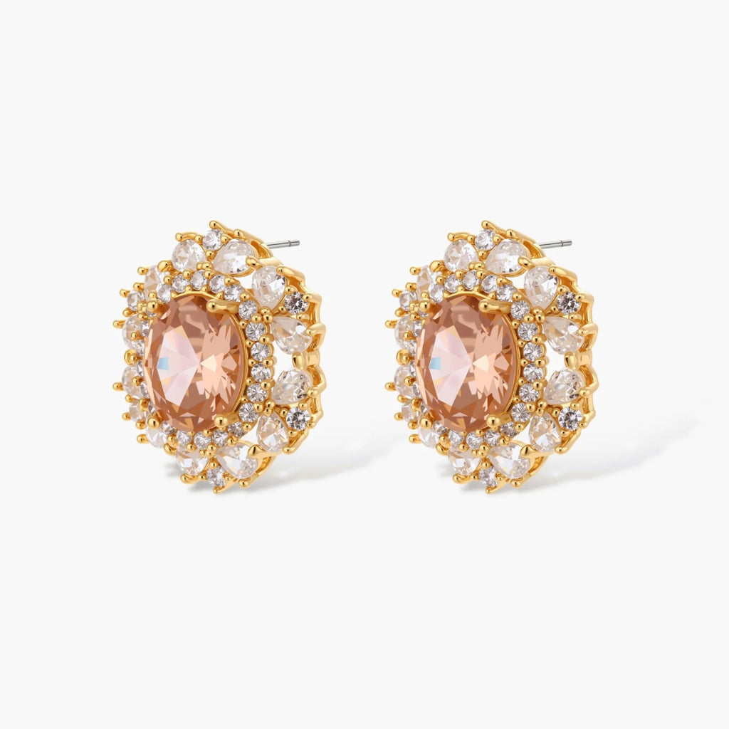 Ornate gold-plated jewelry set featuring peach center stone surrounded by clear AAA cubic zirconia crystals