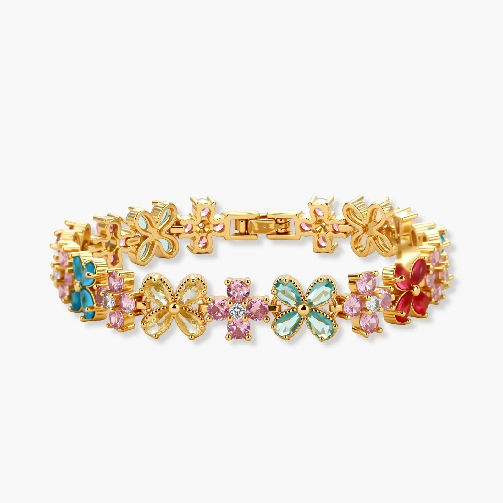 Gold-plated jewelry set with pink, turquoise and red flower-shaped cubic zirconia stones, featuring necklace, earrings and bracelet.