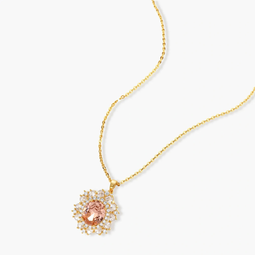 Ornate gold-plated jewelry set featuring peach center stone surrounded by clear AAA cubic zirconia crystals