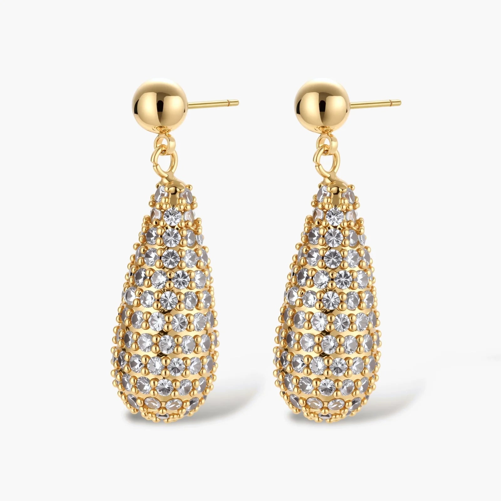 Gold-plated teardrop necklace and earrings covered in AAA cubic zirconia crystals on cream background.