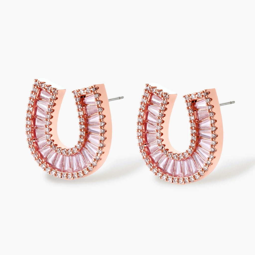 Sparkling horseshoe-shaped jewelry set with AAA cubic zirconia in gold-plated and white gold finishes on cream background.