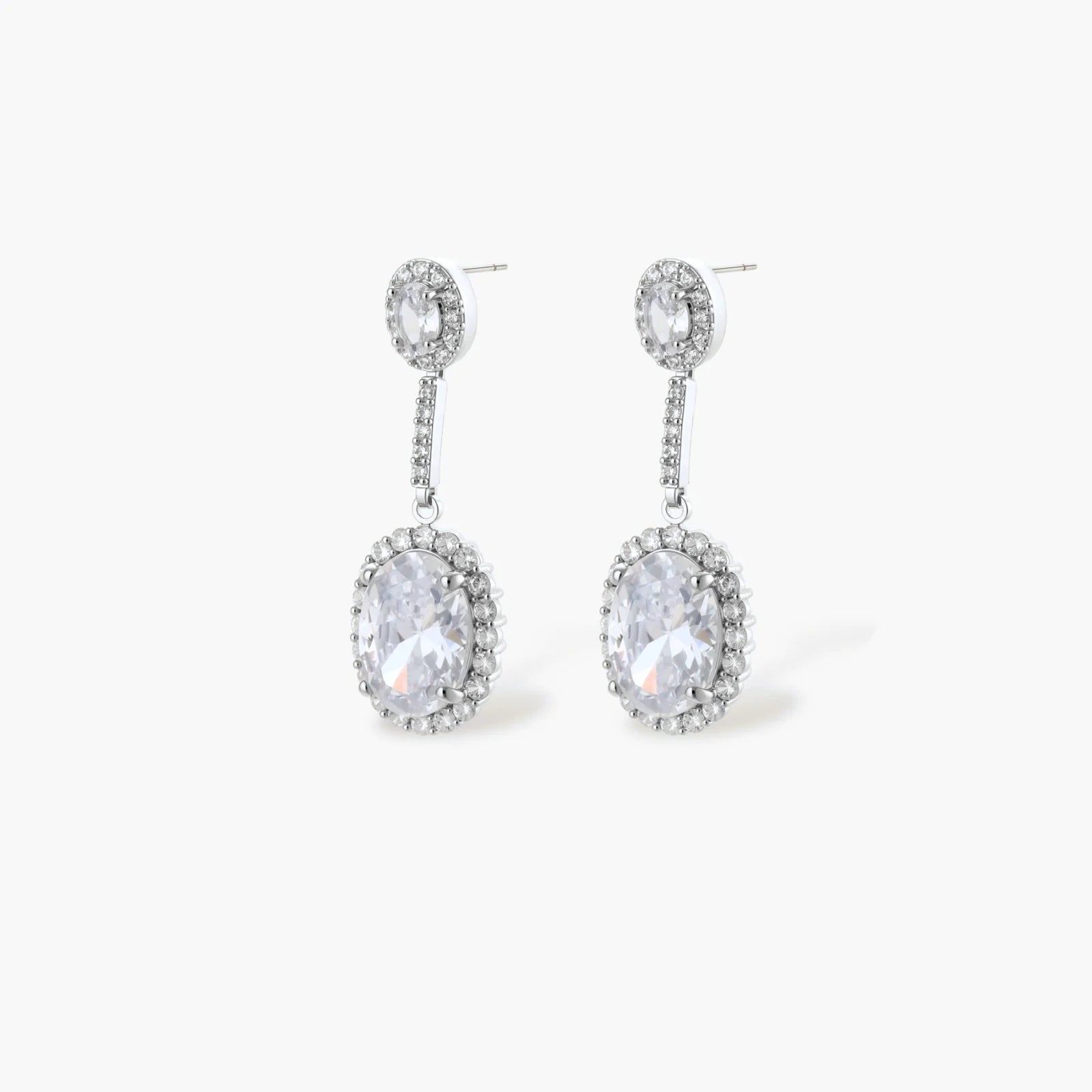 Elegant white gold plated jewelry set with oval cubic zirconia stones in halo settings, featuring Y-necklace and drop earrings.